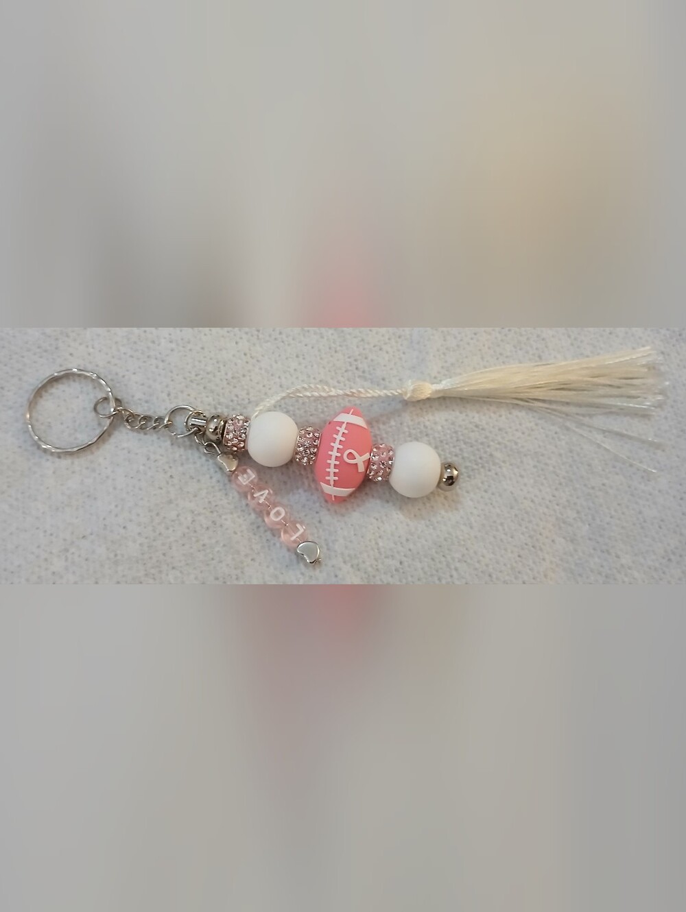 NWT Handcrafted Breast Cancer Awareness Pink Football Charm Keychain w/Tassel.